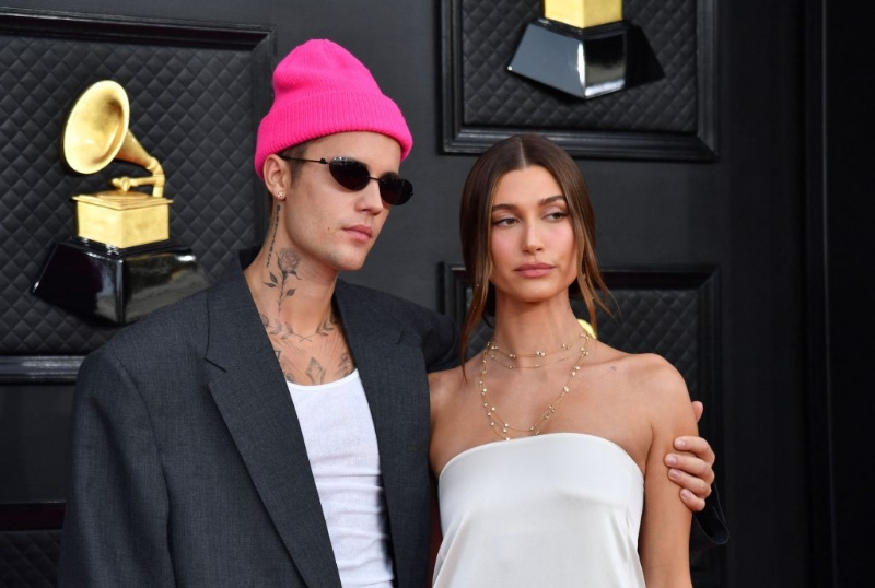 Hailey Bieber's Neon Bikini Thirst Traps Prove She's "Ready For Summer"