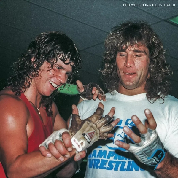 Chris Von Erich sat cross-legged on the mat, his eyes locked onto his older brother Kerry, who stood