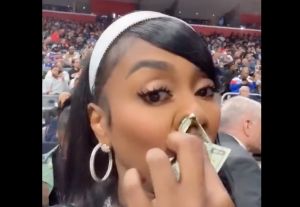 SEE IT: Kash Doll Sparks Social Reaction After Using $20 Bill as Tissue at Pistons Game