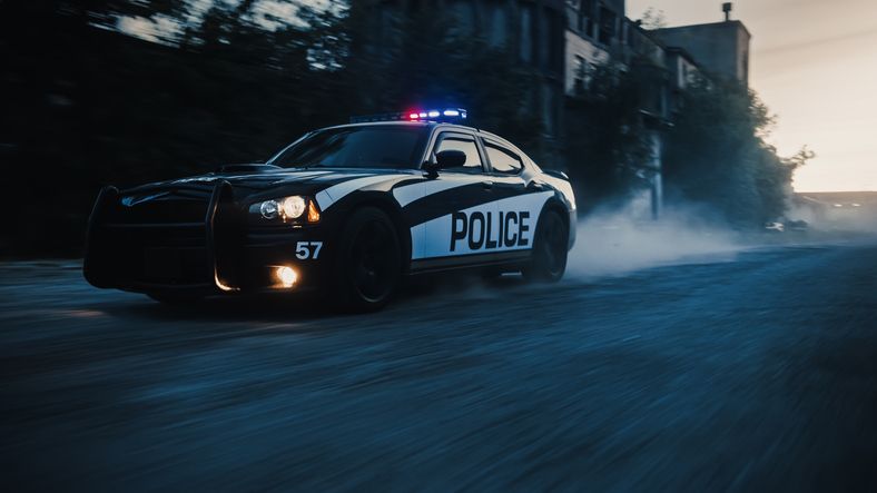 Watch This, Watch This: Iowa Cop Breaks Back After Clinging To Roof Of Suspect's Car During High Spe
