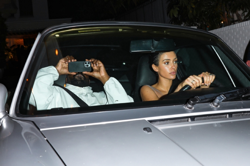Bianca Censori & Kanye West Cloak Up For Florence Airport With Bizarre Outfits