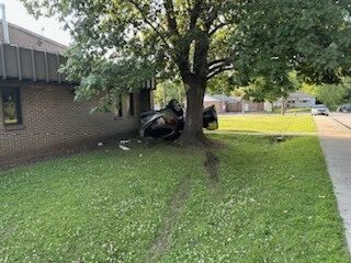 2 injured after car flips into fire station on near west side of Indianapolis