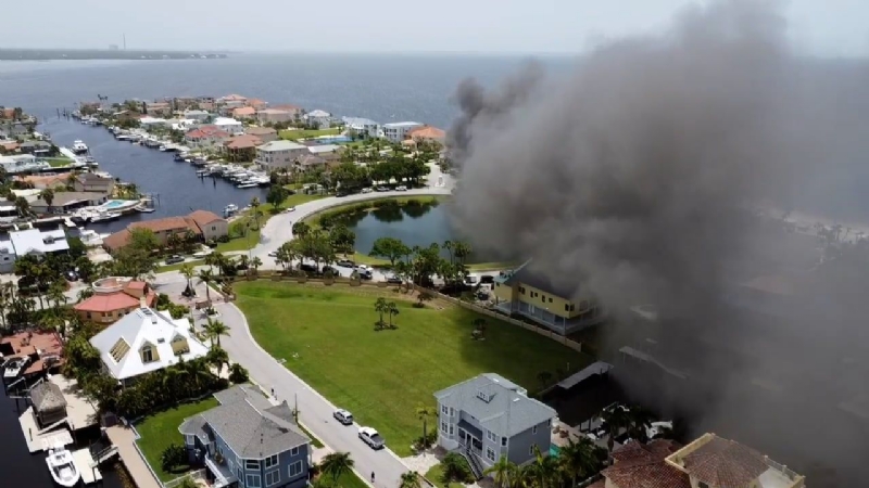 Crews battle three-story house fire in New Port Richey
