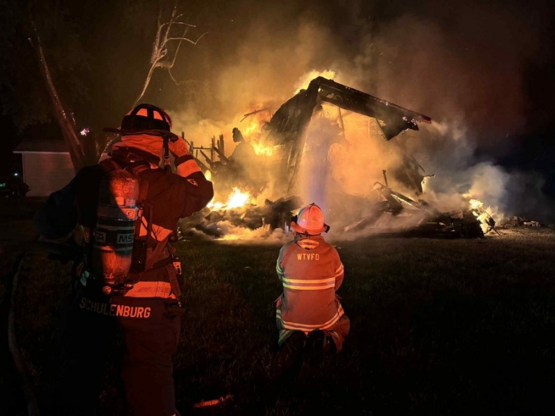 Elwood home engulfed in flames while residents out of town
