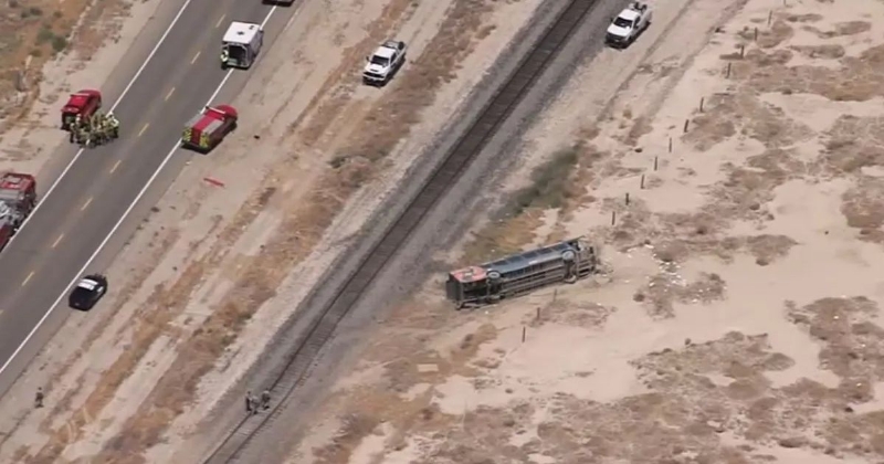 Bus crashes into train tracks and leaves 20 injured as rescuers battle chaos