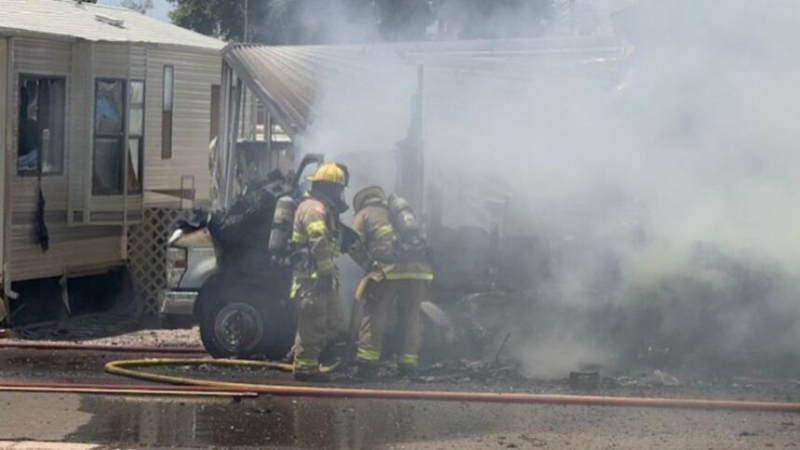Fire crews in battle RV fire on Eighth Street