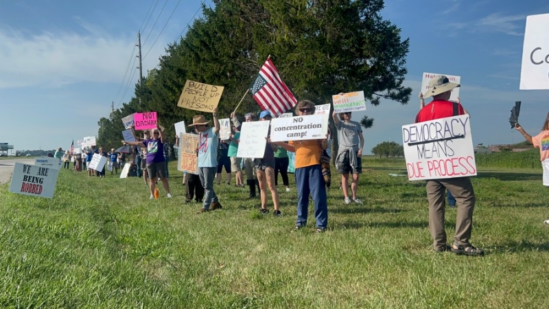 Protestors march outside Miami Correctional Facility, speak out against ICE's 'Speedway Slammer' pla