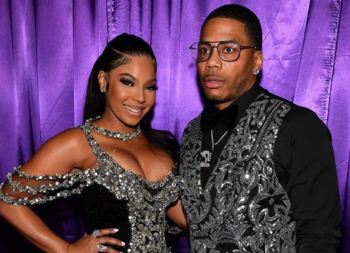 Ashanti Cutely Confirms Rekindled Nelly Romance By Proudly Portraying Personalized Picture Purse