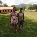 Rita with child who has one parent living and is not in school; Karamoja, Uganda