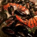 Process Of Cooking Mussels, and Lobster tossed in Chateau Saint Michelle Chardonnay