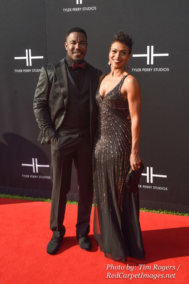Actor Michael Jai White and his Wife attend Tyler Perry's Atlanta Studio Grand Opening