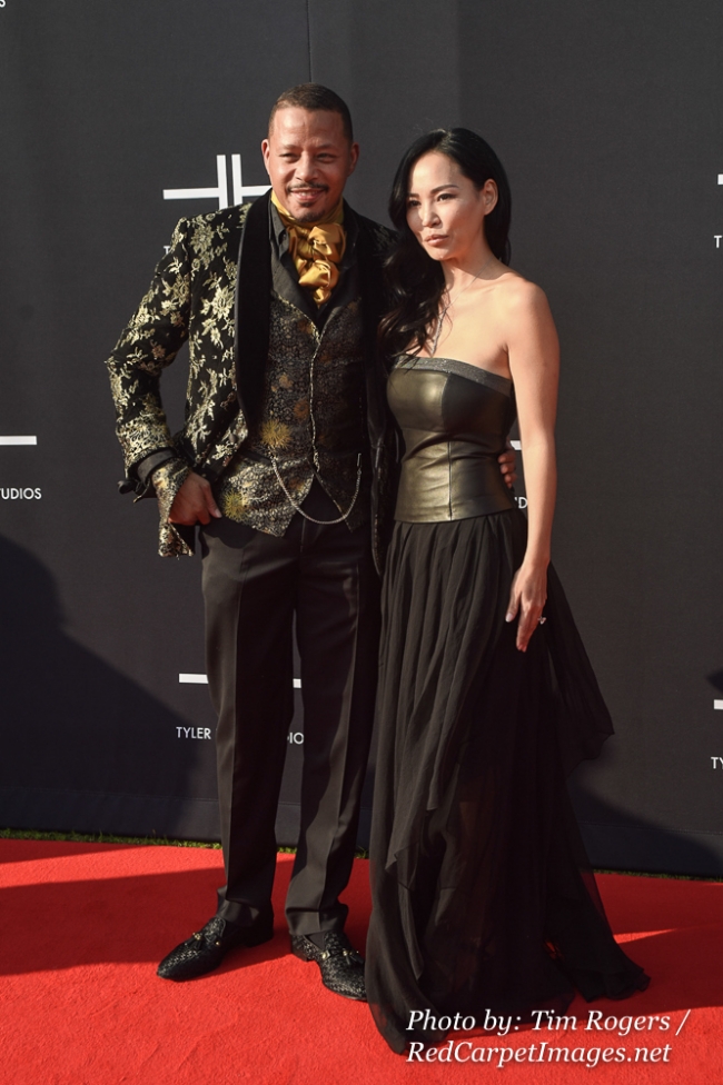 Actor Terrence Howard and a Guest attend Tyler Perry's Atlanta Studio Grand Opening