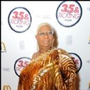 Actress Luenell poses on for cameras on the red carpet