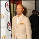 Actor Dondre Whitfield arrives to the red carpet at the movie screening