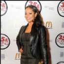 Actress Tamala Jones poses on the red carpet at the movie screening