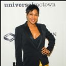 Terri Vaughn stops and poses on the red carpet