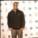 Auburn QB Cam Newton stops for a photo at the Superbowl XLV Players Party