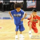 A hip hop dance duo entertains the crowd at halftime of the NBA Celebrity Basketball Game
