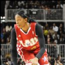 WNBA Star Swin Cash dribbles up court