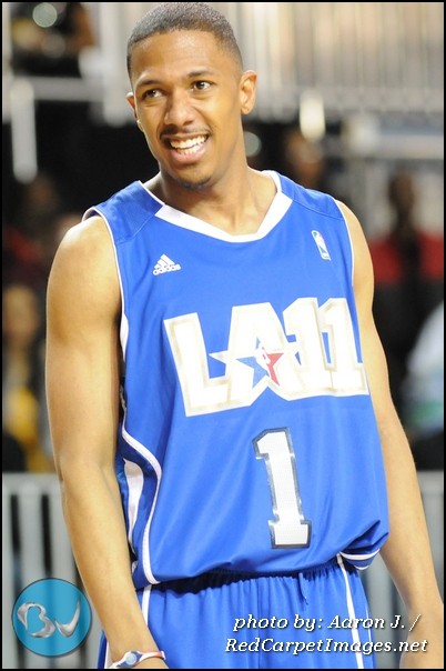 Nick Cannon smiles at fans at the NBA AllStar Celebrity Basketball Game