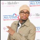 Singer Ne-Yo stops for the cameras as he arrives for the NBA AllStar Game in Los Angeles