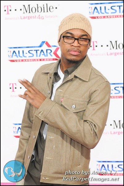 Singer Ne-Yo stops for the cameras as he arrives for the NBA AllStar Game in Los Angeles