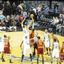 Wizards JaVale McGee and Cavaliers Ryan Hollins on the opening tip