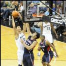 Wizards Yi Jianlian shoots over the Hawks Zaza Pachulia