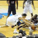 Players scramble for the lose ball during the game