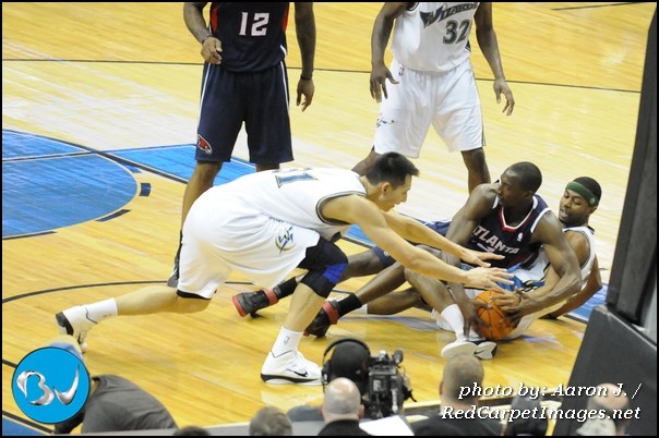 Players scramble for the lose ball during the game
