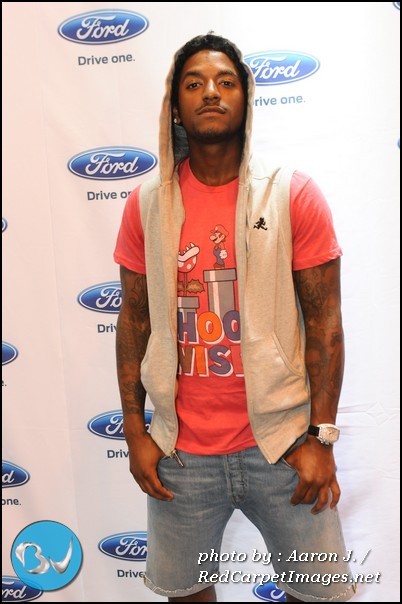 Singer Lloyd stops for a picture backstage at the Convention Center for Essence Fest 2011