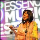 Gospel Artist CeCe Winans receives an Essence award and shares a moment with the crowd