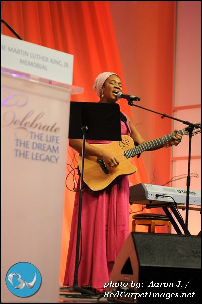Indie Arie performs during the luncheon