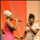 Indie Arie and Ledisi performing together at the luncheon