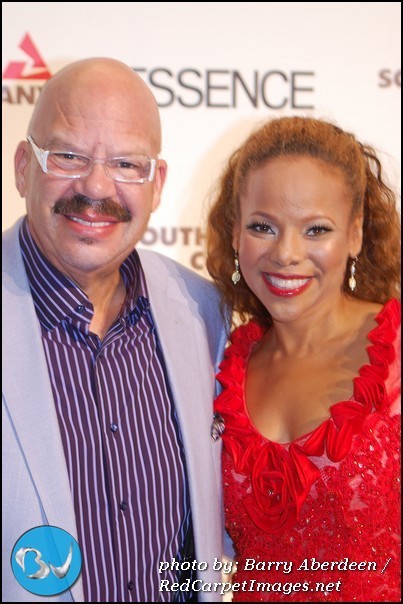 Tom Joyner and Wife Denise Richards on the red carpet before being honored