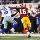 Redskins Brandon Banks tries to get past a Cowboys defender on a return