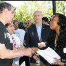 DC Mayor Vincent Gray shakes the hand of Dominique Sharpton (Daughter of Rev. Al Sharpton)