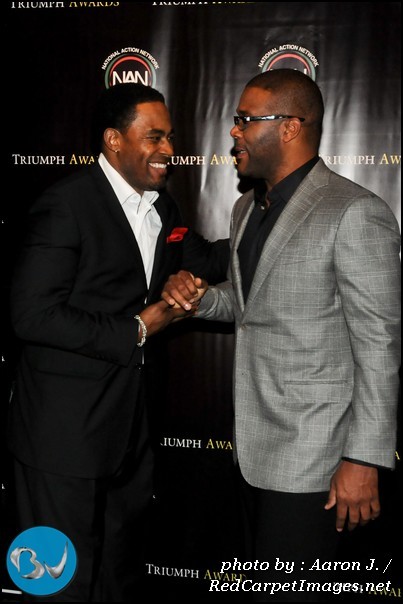 Actor Lamman Rucker greets Honoree Tyler Perry on the red carpet for the 2011 Triumph Awards