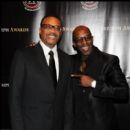 Honoree Judge Greg Mathis jokes with 2011 Triumph Awards performer Grammy Nominee Joe