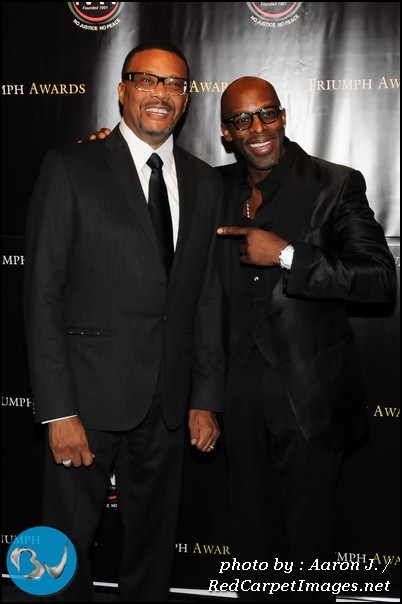 Honoree Judge Greg Mathis jokes with 2011 Triumph Awards performer Grammy Nominee Joe