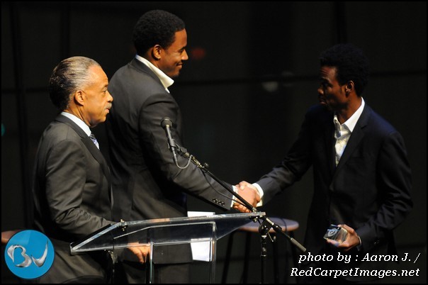 Comedian Chris Rock receives his awards and is congratulated by Actor Lamman Rucker and Rev Al Sharpton 