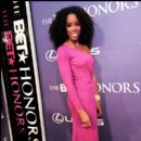 Singer Kelly Rowland shows off her dress at the BET Honors