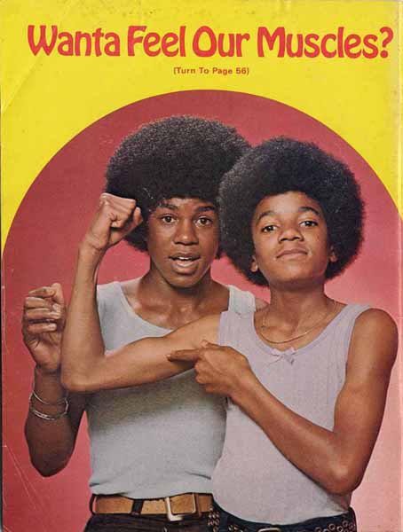 Michael Jackson and Jermaine Jackson...is that a bow on Michael's shirt?