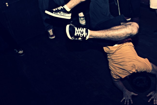 Break dancer doing a crazy handstand