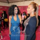 Singer Claudette Ortiz inteviewing Actress/Rapper/Producer Queen Latifah